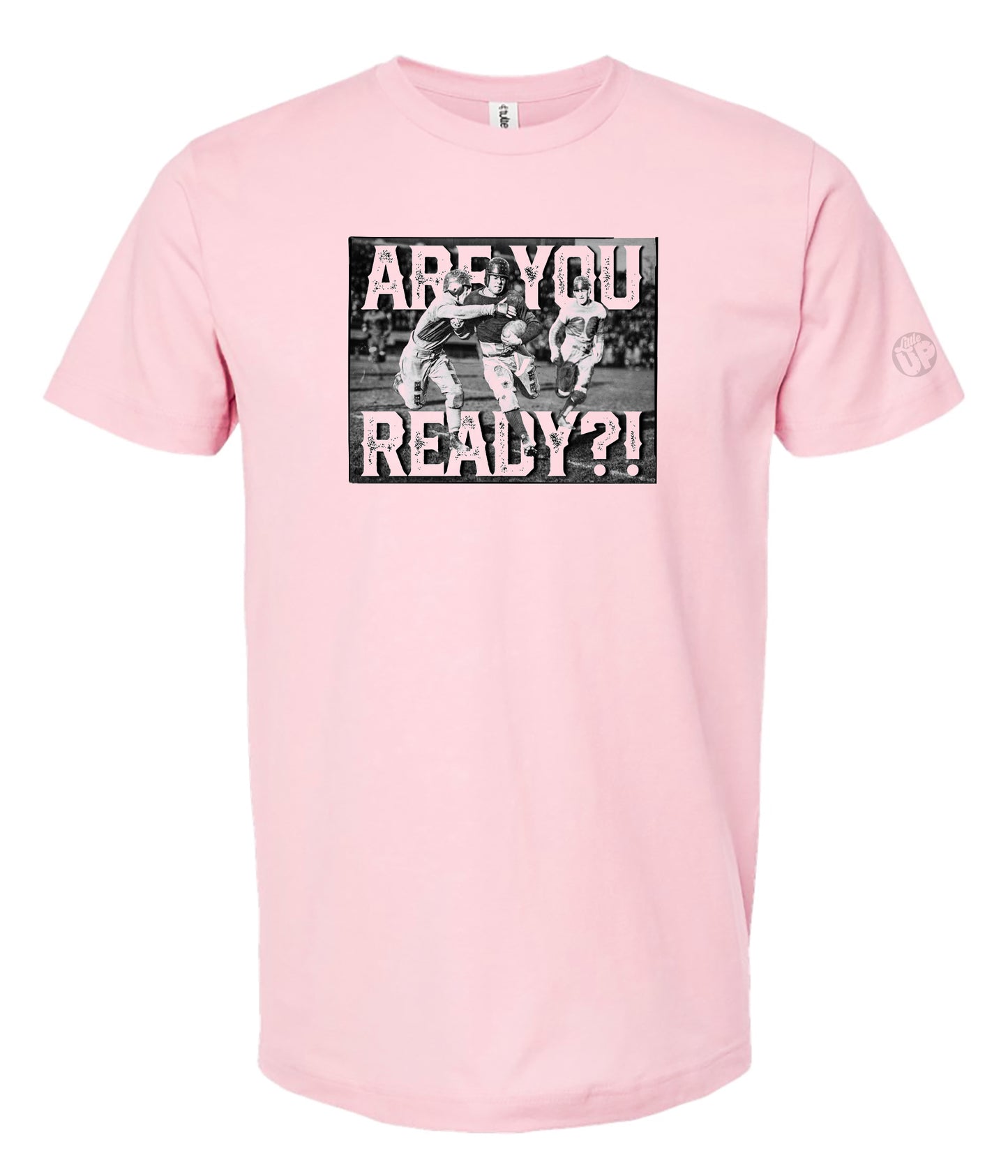pink t-shirt featuring a vintage-style image of three football players in action with bold text "ARE YOU READY?!" conveying excitement and anticipation.