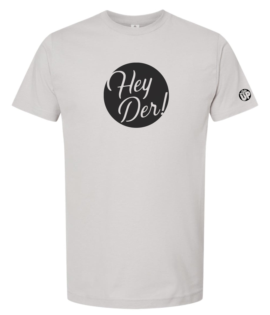 black circle with "Hey Der!" in modern script on light gray t-shirt, "Little UP" in circle small on sleeve