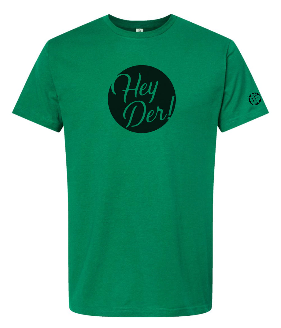 black circle with "Hey Der!" in modern script on Kelly green t-shirt, "Little UP" in circle small on sleeve