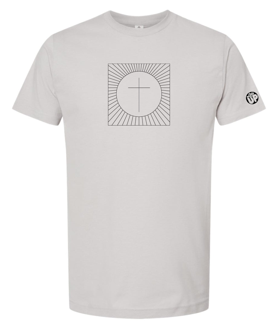 simple cross in a circle which is in a square with lines radiating from the circle to the square, printed in black on a light gray t-shirt