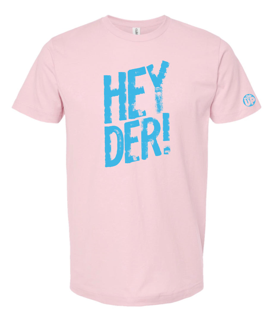 Big "HEY DER!" in textured font in light blue on pink t-shirt