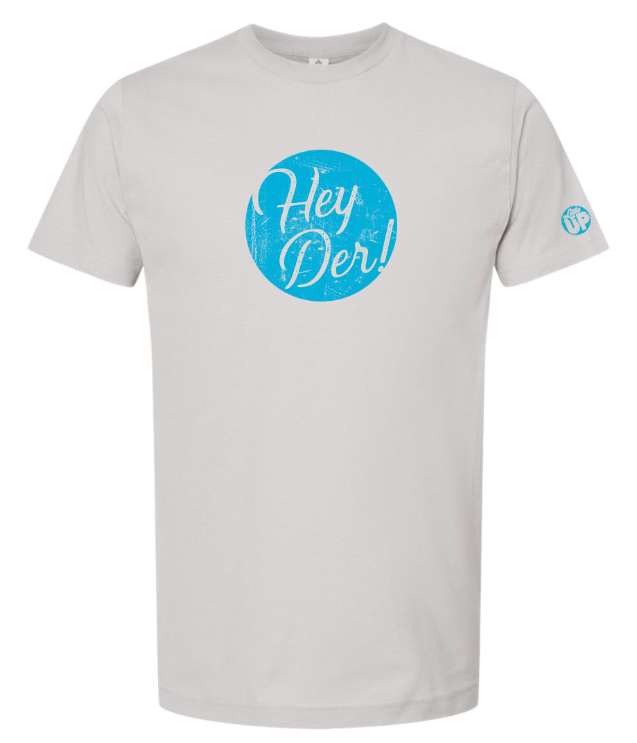 "Hey Der!" in script font, white on textured light blue circle, on light gray t-shirt on white background