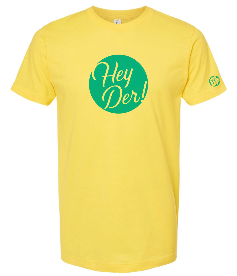 "Hey Der!" in script font, white on light blue circle, on yellow t-shirt on white background