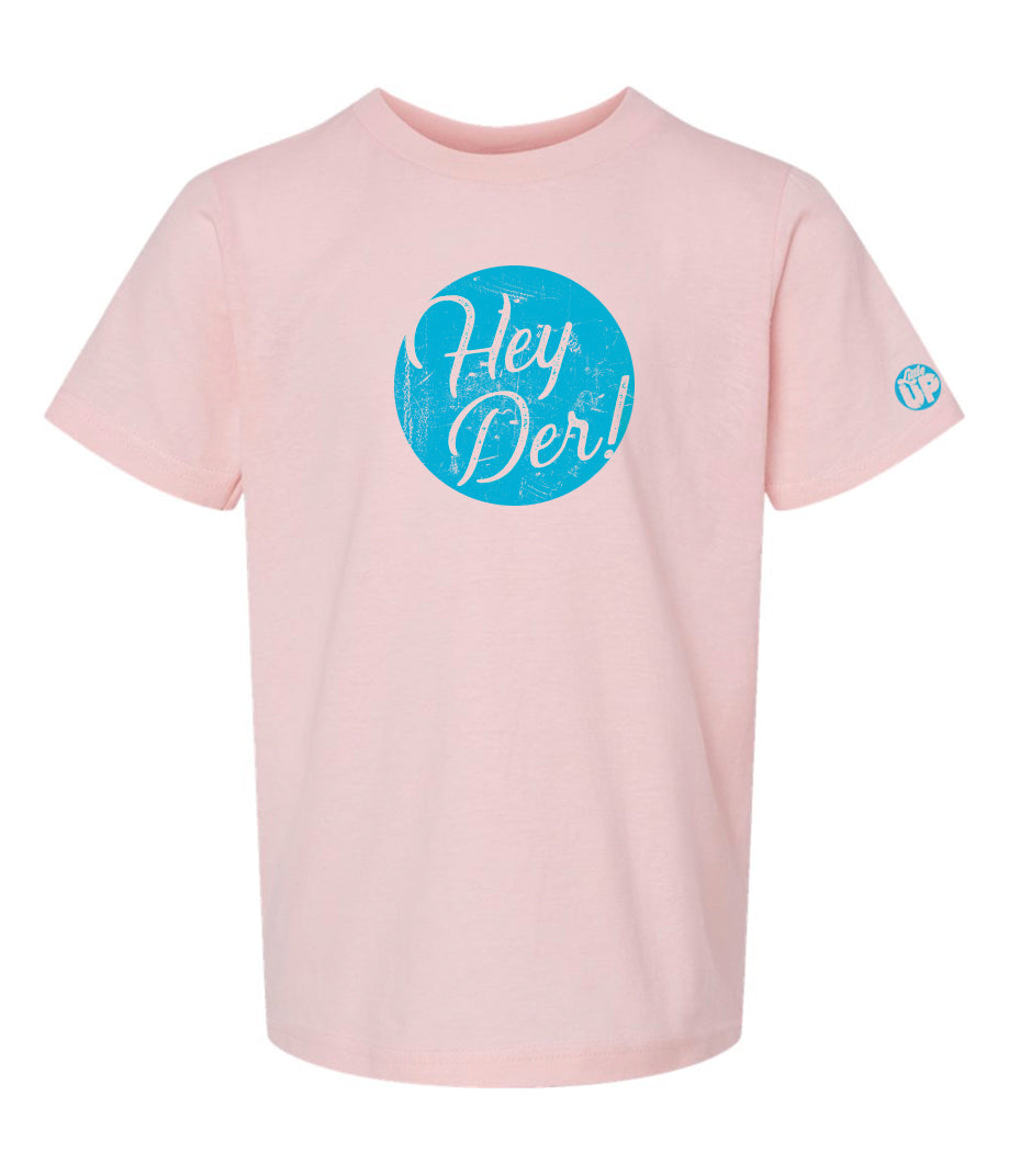 "Hey Der!" in script font, white on textured light blue circle, on pink youth t-shirt on white background