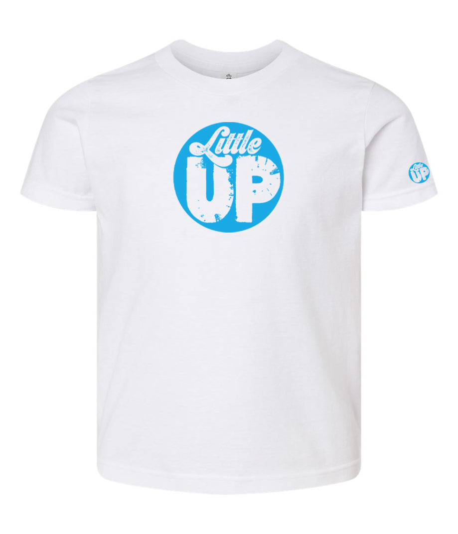 light blue circle logo with "Little" in the top third in textured seventies script and "UP" on the bottom ⅔ in modern sans serif textured font on white youth t-shirt on white studio background