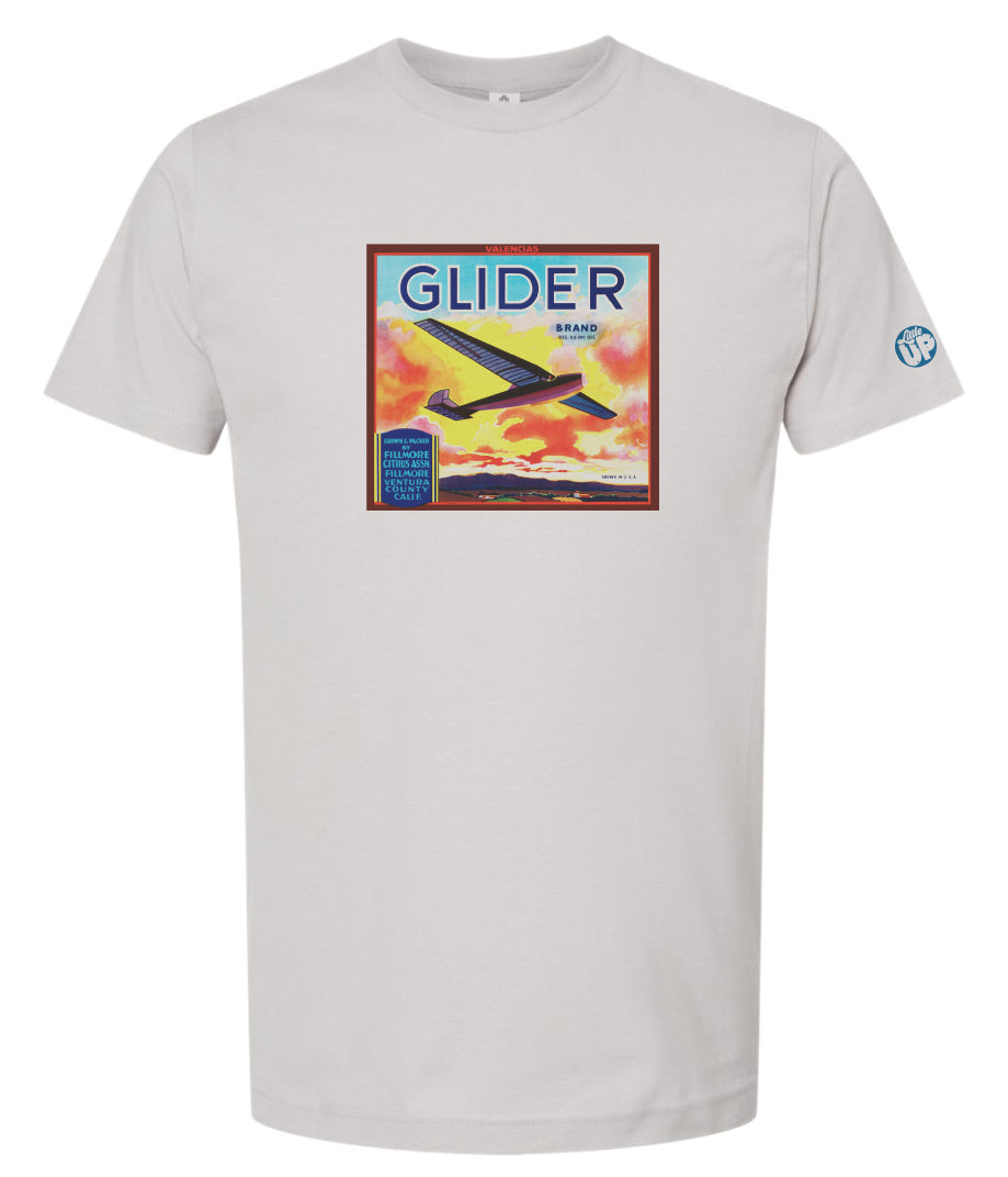 vintage packaging with glider plane and beautiful sunset over mountains on light gray t-shirt
