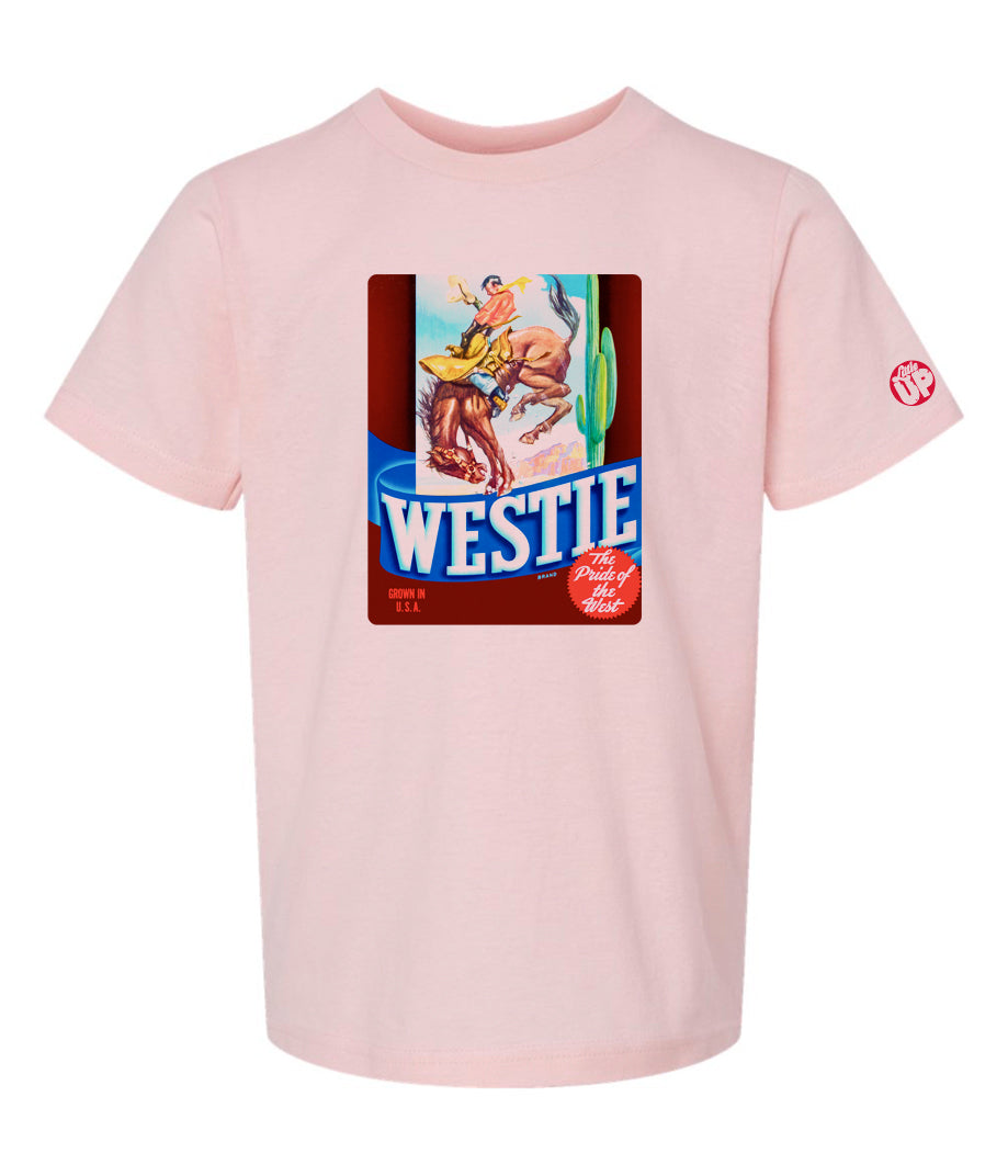 vintage graphic of cowboy riding bucking horse with "WESTIE" big at the bottom, on pink youth t-shirt on white background