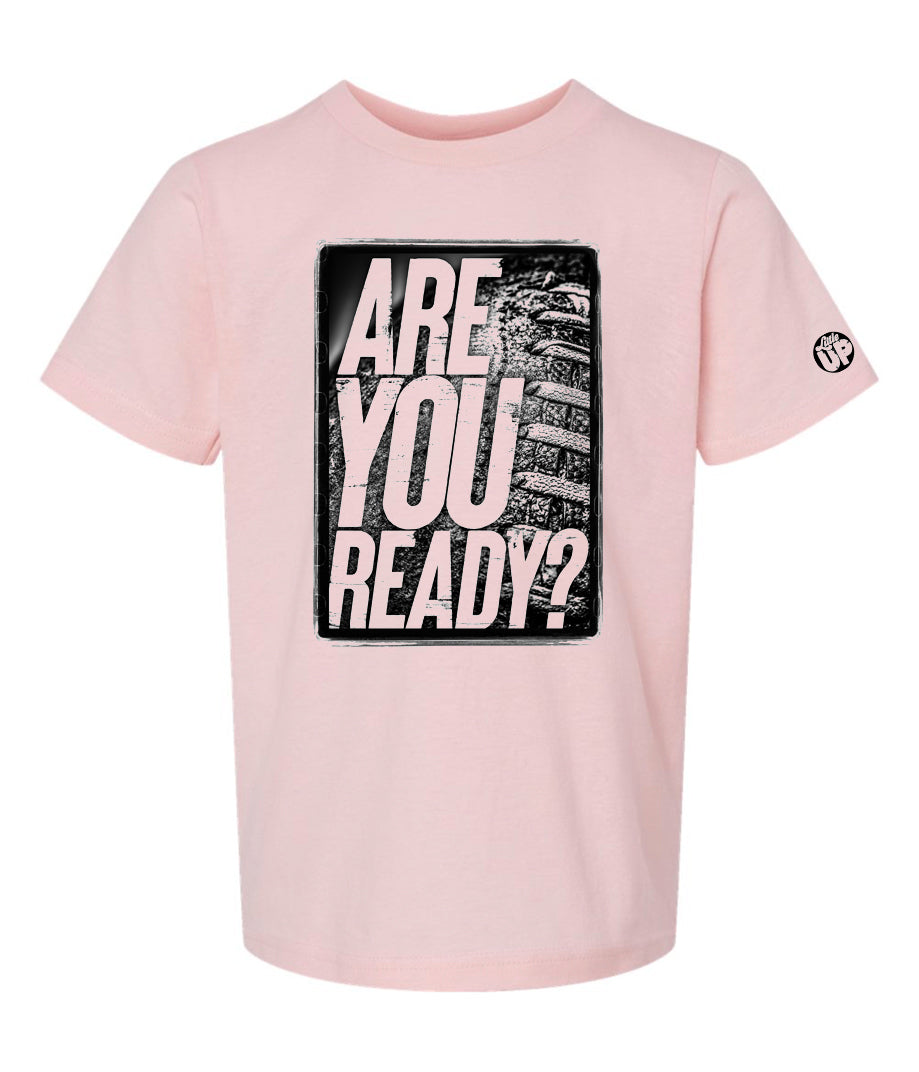 black and white image, "ARE YOU READY?" in textured modern font on old American football photo with rough border on pink youth t-shirt