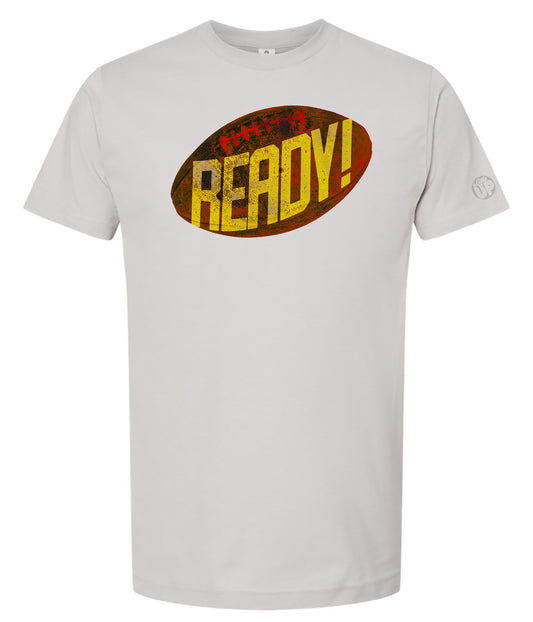 light gray t-shirt with a graphic of a football and the word "READY!" in bold yellow letters. The design has a distressed, vintage look.