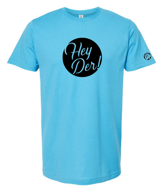 black circle with "Hey Der!" in modern script on bright blue t-shirt, "Little UP" in circle small on sleeve