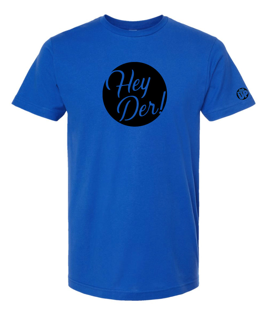 black circle with "Hey Der!" in modern script on royal blue t-shirt, "Little UP" in circle small on sleeve