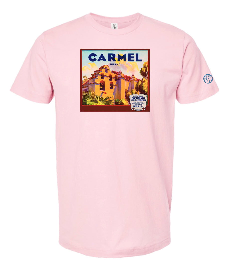 vintage "Carmel Brand" packaging graphic with old mission looking structure with terra cotta roof and stucco sides on pink tee on white background