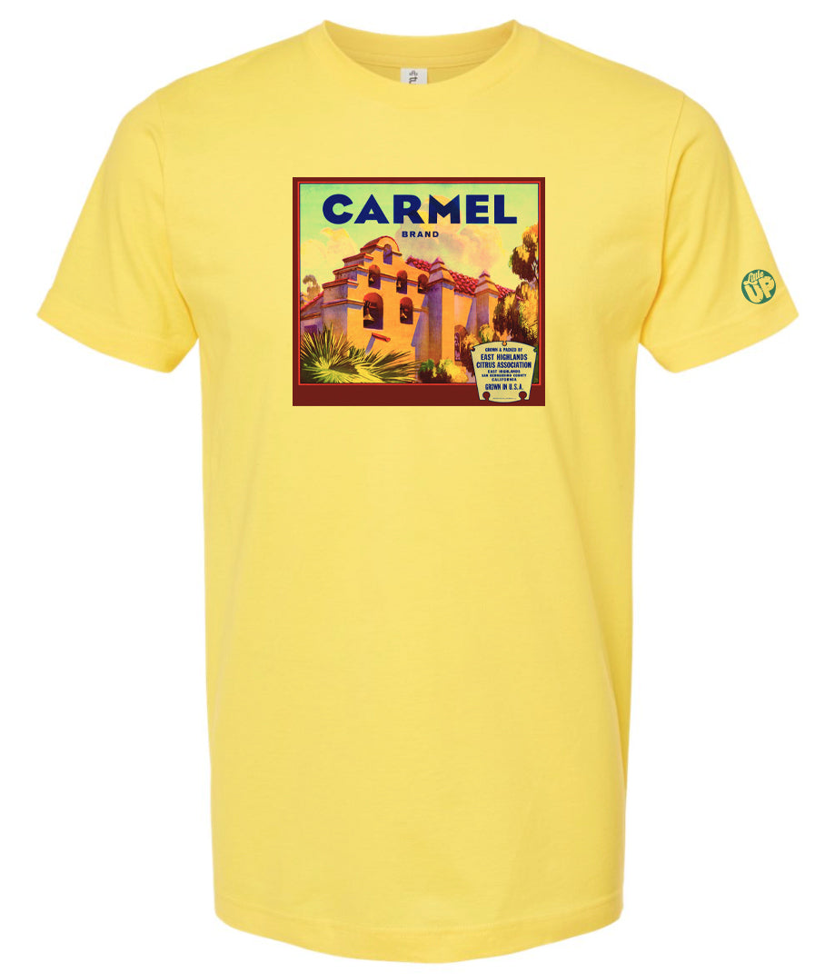 vintage "Carmel Brand" packaging graphic with old mission looking structure with terra cotta roof and stucco sides on yellow tee on white background