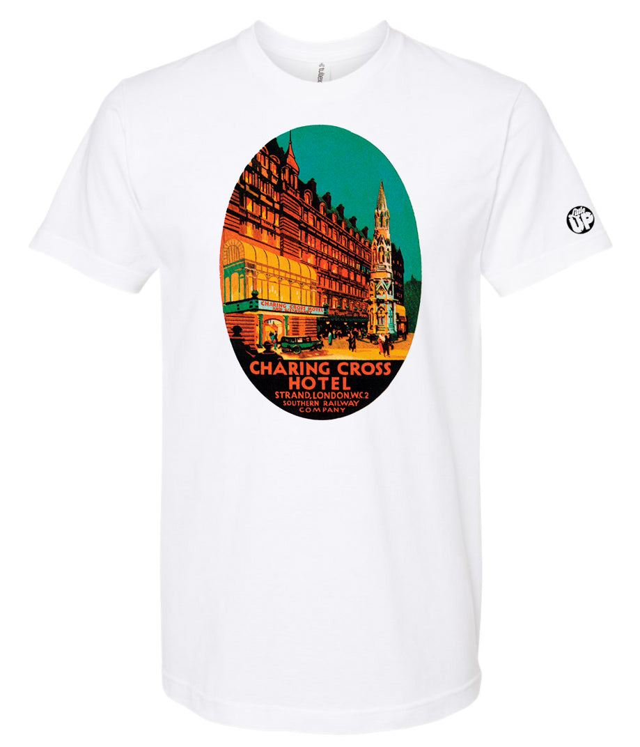 oval illustration of old hotel in London, colors include orange, teal green, yellow and black, printed on white t-shirt on white background