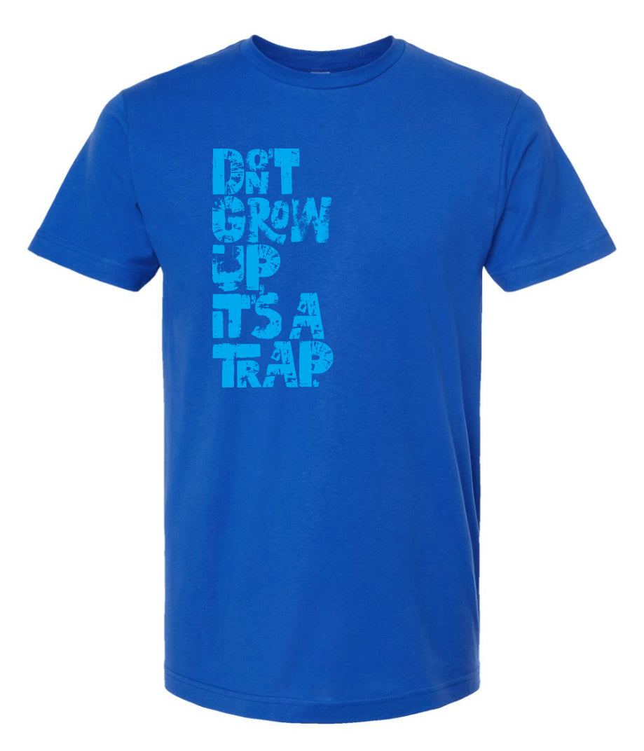 "DON'T GROW UP, IT'S A TRAP" in light blue in fun, textured font on royal blue t-shirt