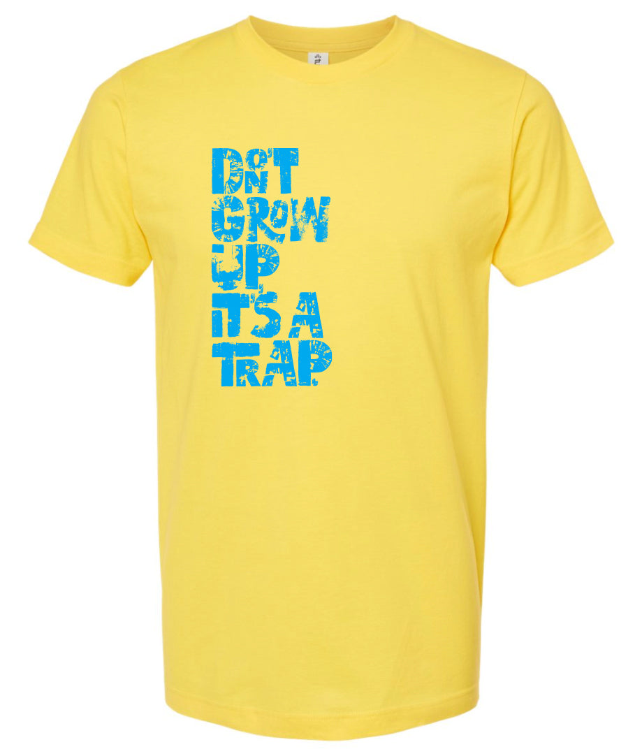 "DON'T GROW UP, IT'S A TRAP" in light blue in fun, textured font on yellow t-shirt