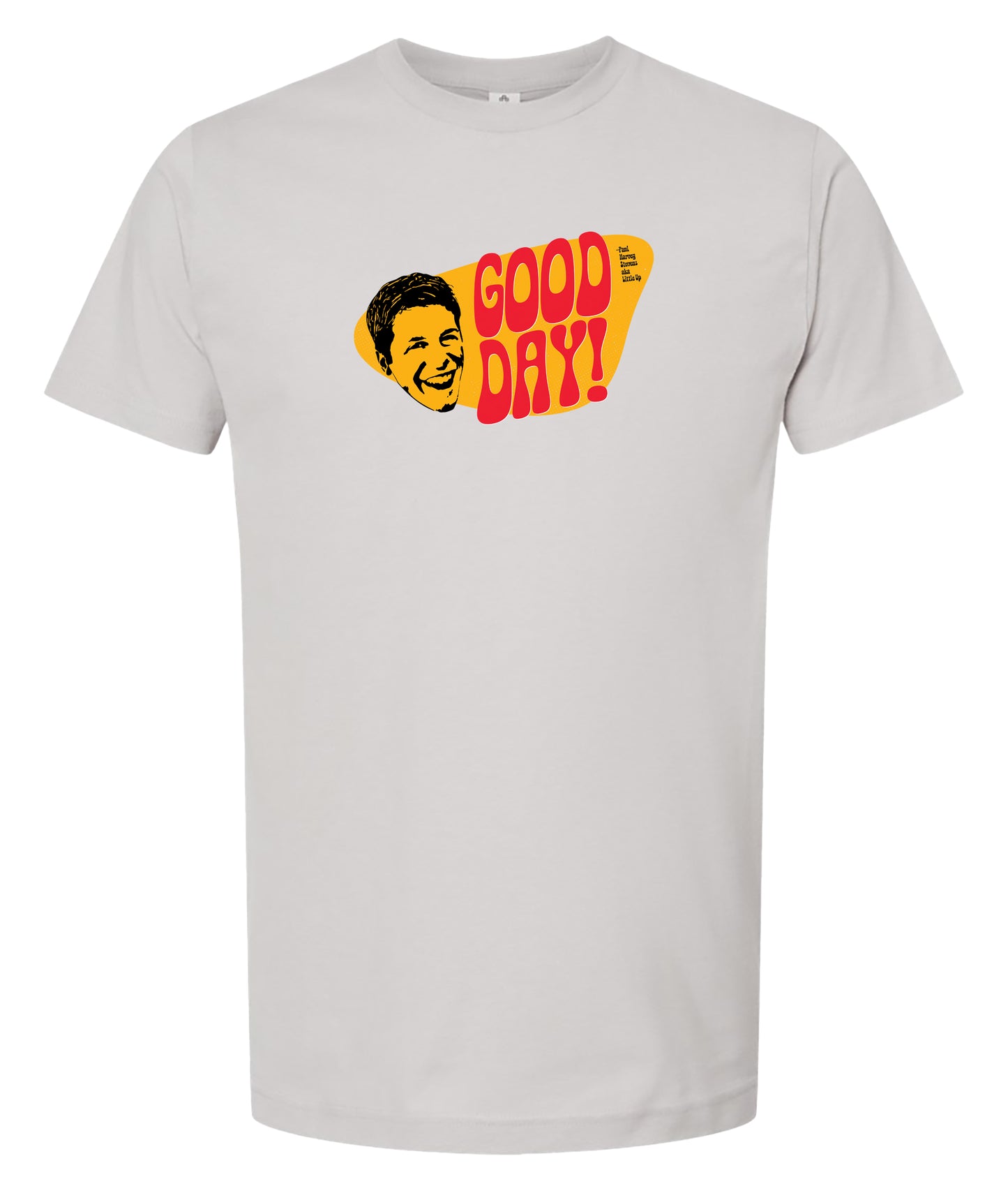 A light gray crewneck t-shirt featuring a retro graphic print on the chest with the text 'GOOD DAY!' in red and yellow, alongside a stylized yellow face illustration.