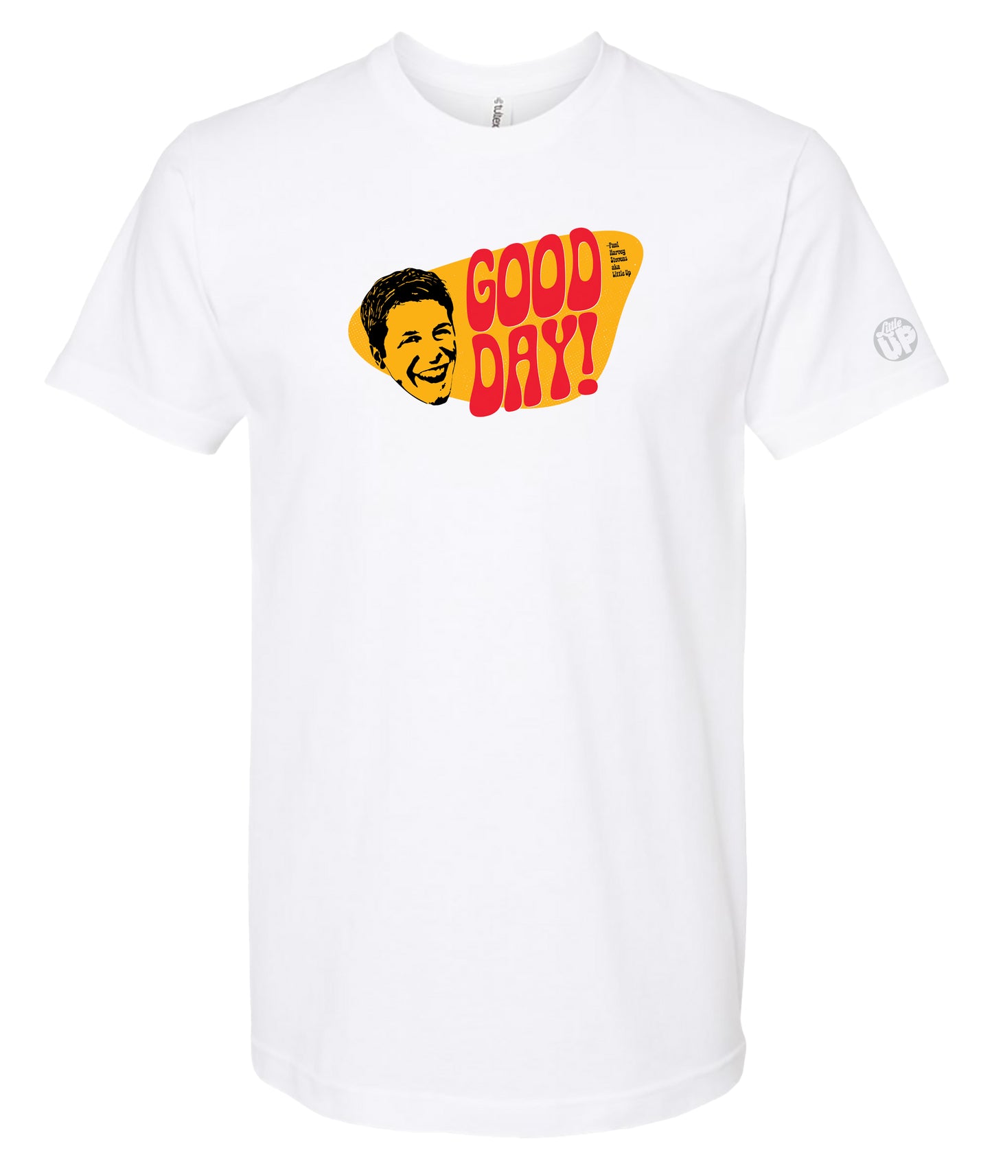A white short-sleeve crewneck t-shirt featuring a retro graphic on the chest with a yellow and red speech-bubble shape containing the text 'GOOD DAY!' and a stylized yellow face illustration.
