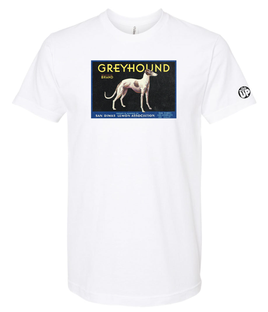 vintage packaging with illustration of white greyhound with a few large brown spots, "GREYHOUND" is the headline, printed on white t-shirt