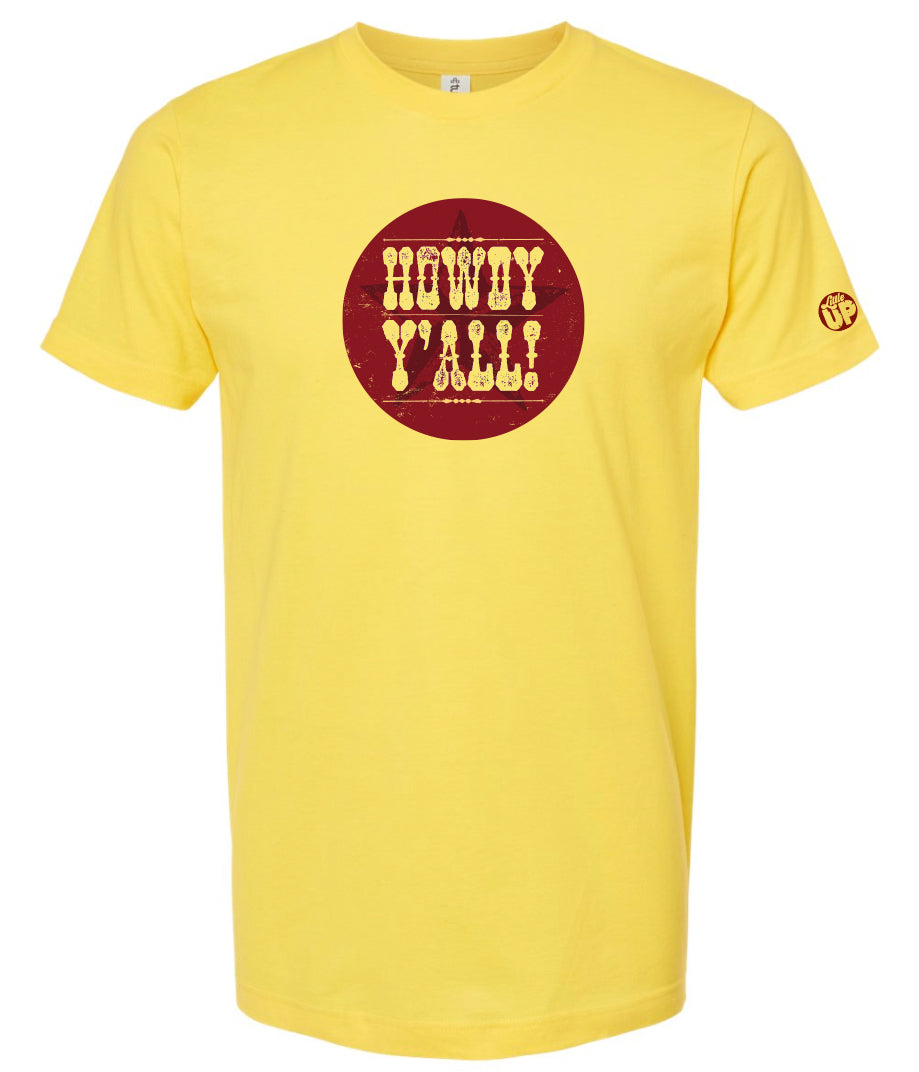 "HOWDY Y'ALL!" in textured western font on burgundy circle with subtle star overlay, on yellow t-shirt