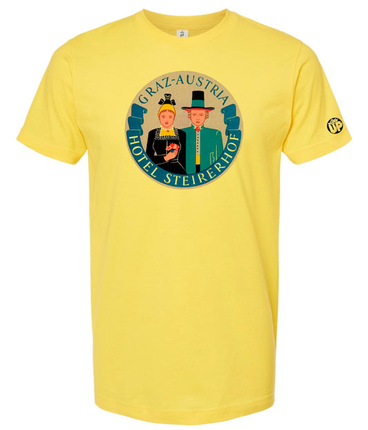 vintage round illustration of old hotel in Austria, colors include blue, orange, teal, yellow and black, printed on yellow t-shirt on white background