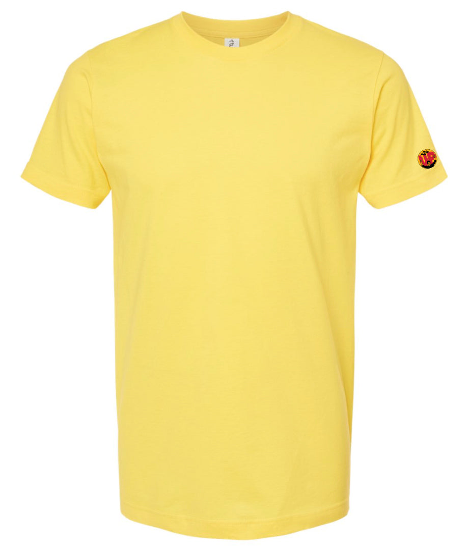 small circle with "Little" at the top in 70s script, "UP" large in red textured sans serif, illustration of young man smiling with arms raised illustration in black at the bottom printed on sleeve of yellow t-shirt