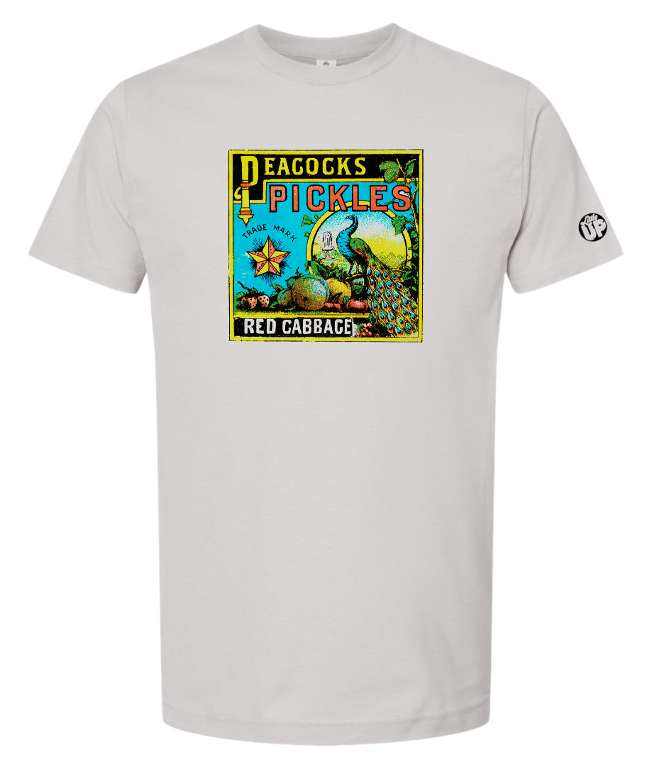 vintage graphic for "Peacocks Pickles" includes an illustration of a peacock, colors are yellow, red, light blue and black on light gray t-shirt