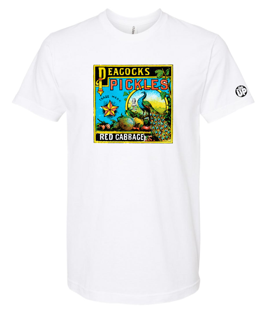 vintage graphic for "Peacocks Pickles" includes an illustration of a peacock, colors are yellow, red, light blue and black on white t-shirt