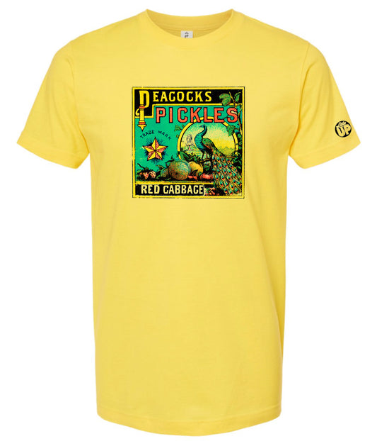 vintage graphic for "Peacocks Pickles" includes an illustration of a peacock, colors are yellow, red, light blue and black on yellow t-shirt