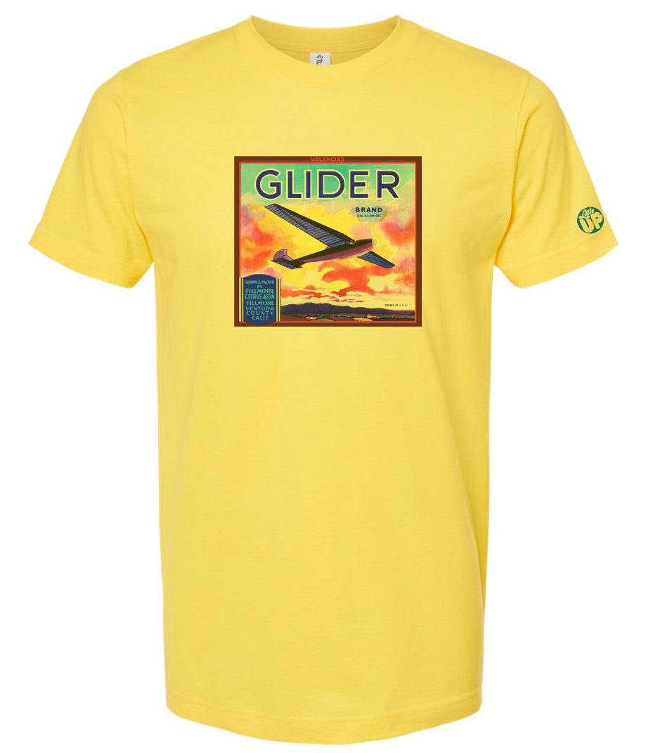 vintage packaging with glider plane and beautiful sunset over mountains on yellow t-shirt