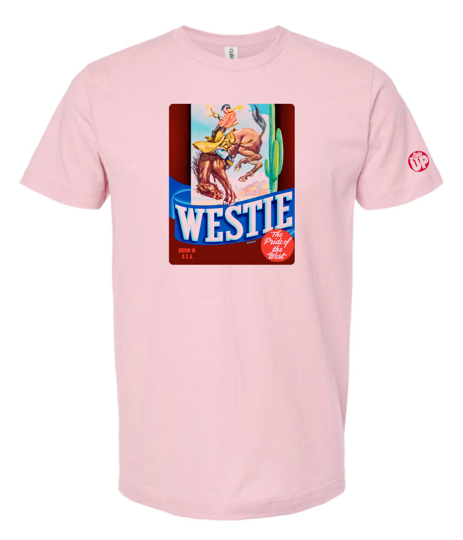 vintage graphic of cowboy riding bucking horse with "WESTIE" big at the bottom, on pink t-shirt on white background