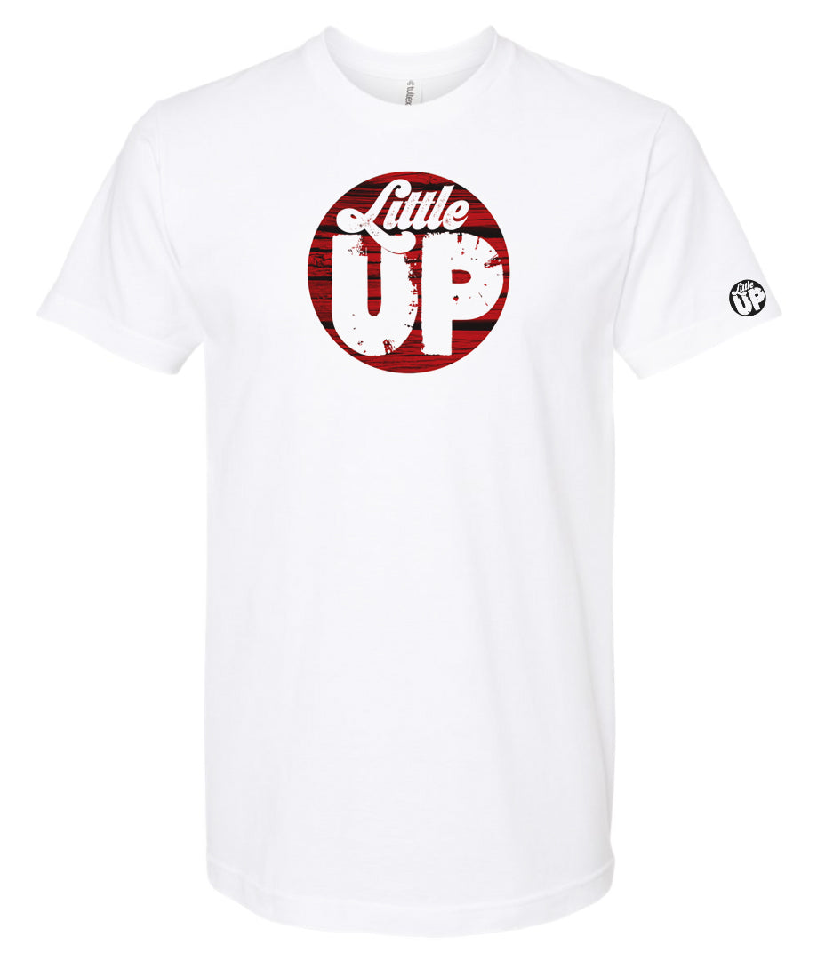 round logo with red wood background and "Little" in textured seventies script and "UP" big in sans serif textured font on white t-shirt on white background